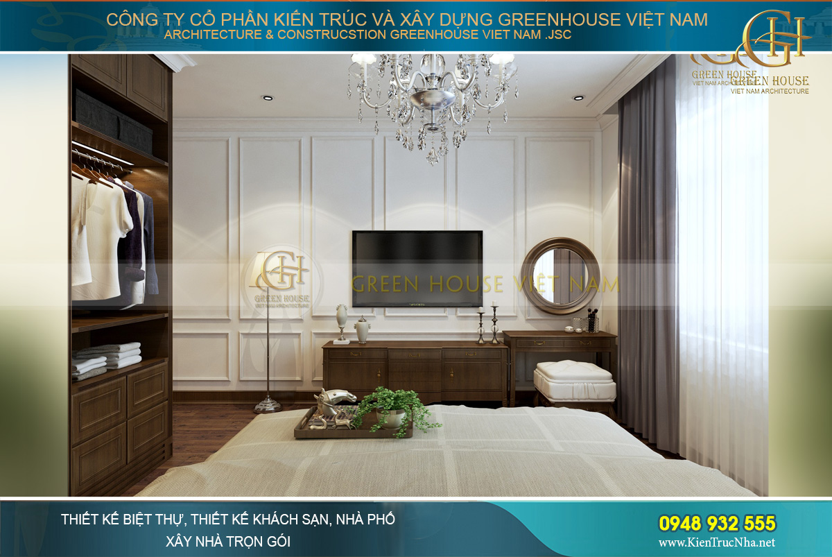 Đối diện giường ngủ là kệ TV và bàn trang điểm